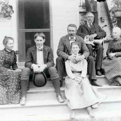 Maude, Brandt, Guy, Otis, Ellen and Floy in front on the steps of the house on Michigan Ave.