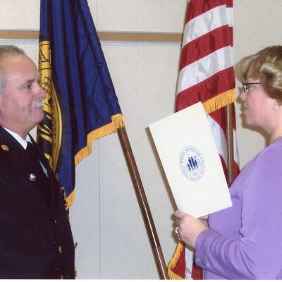 Deputy Chief getting sworn in by City Clerk