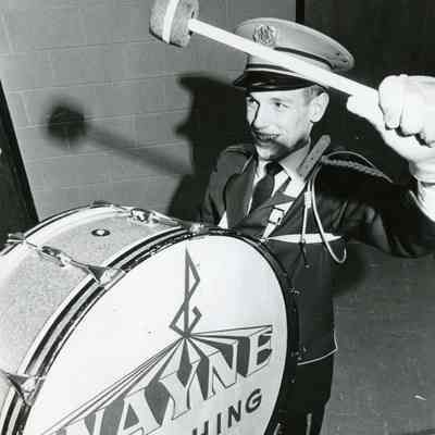 Jim Hisey carrying bass drum