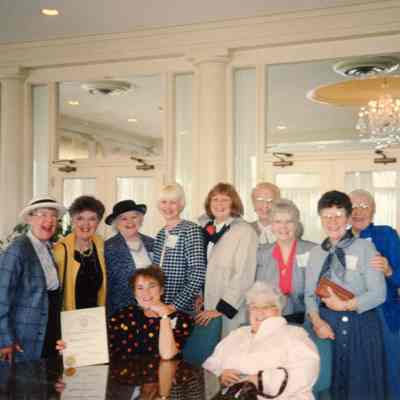 Garden Club members congradulate Mariann Triece on her Life time Membership certificate.
