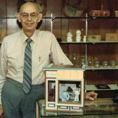 Art Allen with his departing gift from Wayne C of C, crafted by Country Miniatures.