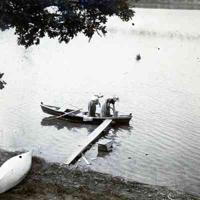 Two women on a canoe.