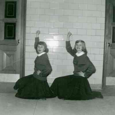 Sondra Anderle and Joan Worden at Wayne High verses Fordson Cheer on Feb.16, 1954.