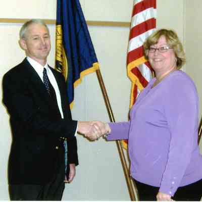 Tom McDonald getting sworn in by Wayne Clerk Mary Carney.