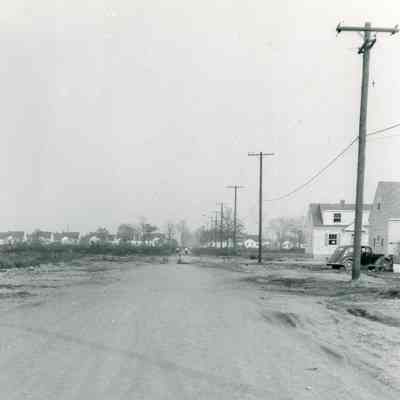Looking East on Forest Ave. Gradomg and gravel by Hatfield.