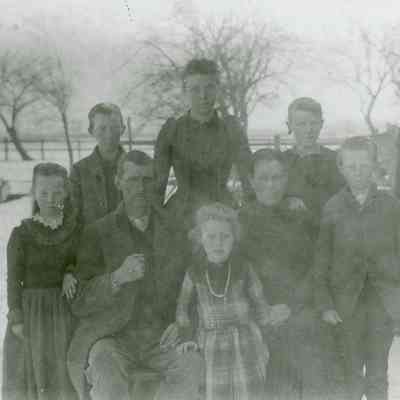 Mr. and Mrs. James Lewis and family. James was a brother to Mrs. Otis Warner. Note Grandmother in background.