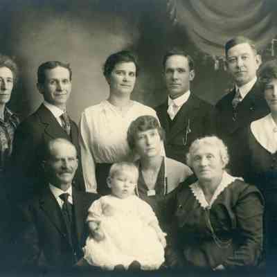 Fass Family. Left to Right: May, Tony, --, ---, Chas Thurston, Grace, Gus, Dora, Mrs. Fass, Baby?