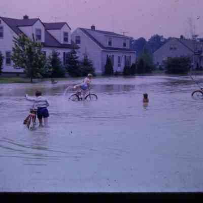 Kids playing in floodwaters