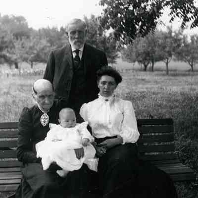Ammon standing in back, Olive & Bertha with Birtha's son. This is four Generations.