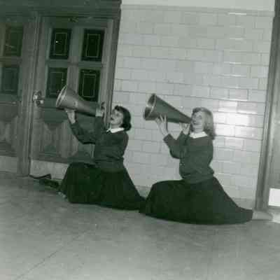 Sondra Anderle and Joan Worden at Wayne High verses Fordson Cheer on Feb.16, 1954.