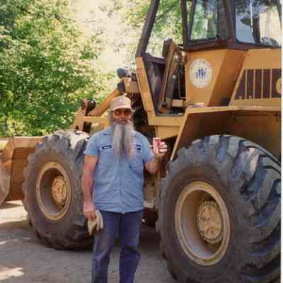 Duane Conklin taking a pop break after removing a log jam.
