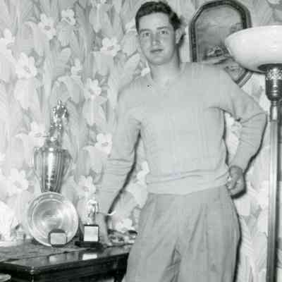 Glen Hall, aged 21, Hockey Goalie with trophies.