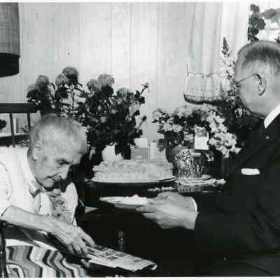 Estelle Bunting on her 100th birthday on March 9,1964 with Rev. Erwin A. Britton at the Clark Convalescent Home.