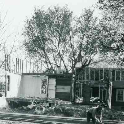 Old House Being Torn Down - New house behind
