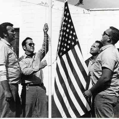 D.P.W Workers Raising the Flag