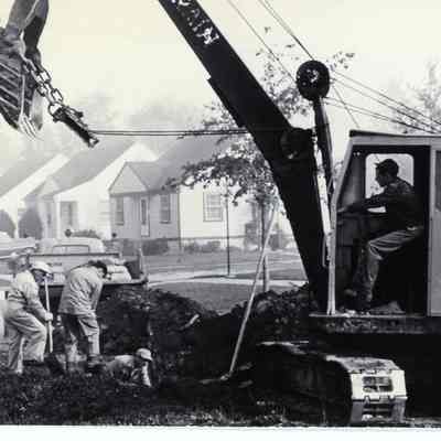 D.P.W workers working on a sewer line.
