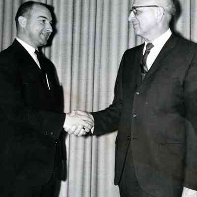 Mr.Guilbault and Mr. Weyend. Marking Mr. Guilbault's promotion to cashier. 1966