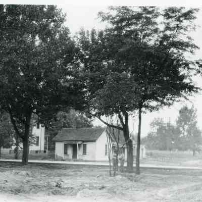 Looking north from Warner property, Michigan Avenue. Site of sign is 34438 Michigan Avenue. Later site of L.Georges Coney Island. House on left was moved to SE corner Sims and 4th to become St. Josephs Church Rectory. House is currently 34437 Sims. Small house in center is Cullen house.