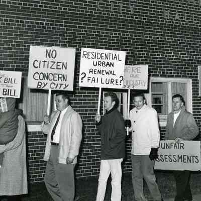 Residents Protesting high taxes after Urban Renewal
