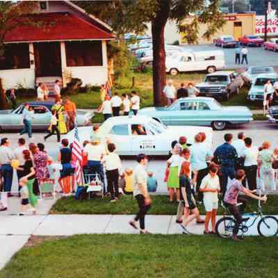 Wayne patrol car, a 1969 Ford leads the Centennial Parade east on Sims St., July 31, 1969. Photo taken from the roof of the police station