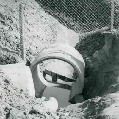 Relaying 48" of sewer pipe on Hannan Rd. Ivan Oliver is doing the work on Oct. 25,1949.