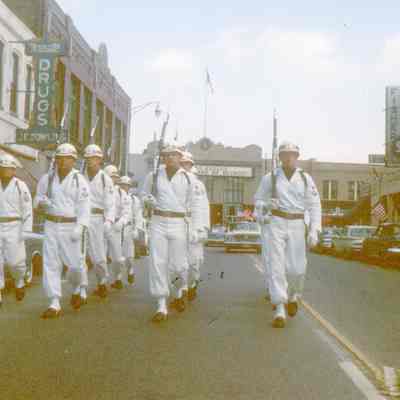 VFW drill team in a parade on Monroe St looking North in 1960.