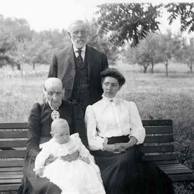 Ammon standing in back, Olive & Bertha with Birtha's son. This is four Generations.