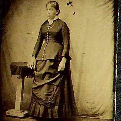 Unknown Woman Posed with Table, undated