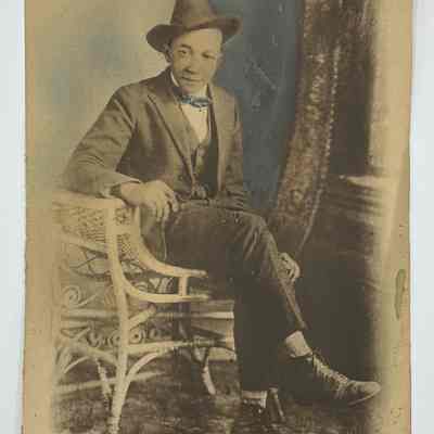 Unknown Man in Wicker Chair, undated