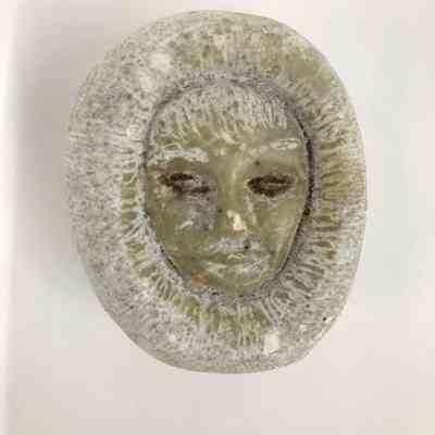 Carved Head wearing Parka