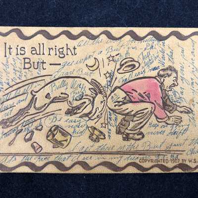 It is all right But- leather postcard