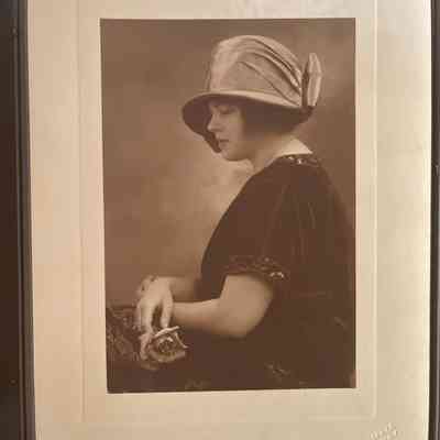 Photo - Portrait of woman in folder