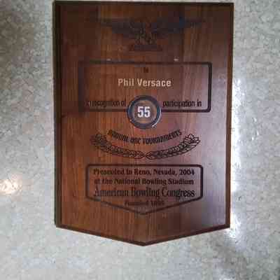 An award to Phil Versace in recognition for his participation in 55 annual ABC tournaments