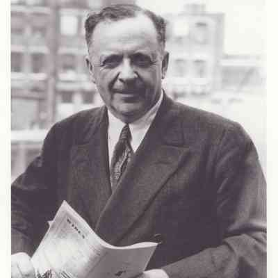 Photo of Edward Bernays holding newspaper