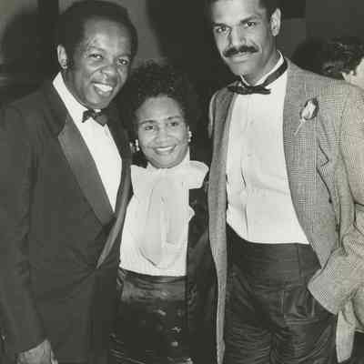 Inez Kaiser posing with Lou Rawls and unidentified man in formal attire