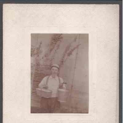 Lewis Summers with basket and pail, no date