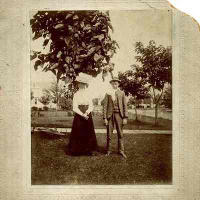 Man and Woman Standing in Grass