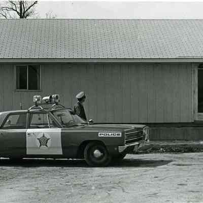 Police car and village multi-purpose building