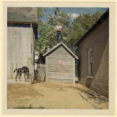 Brian Eul on chicken coop, C. 1960s
