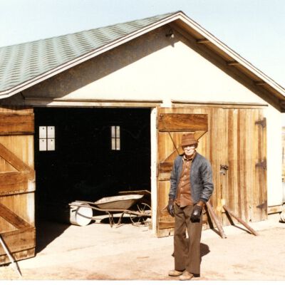 Harry Billington standing in front of the Old Billington Place - corner of 120th and Main St