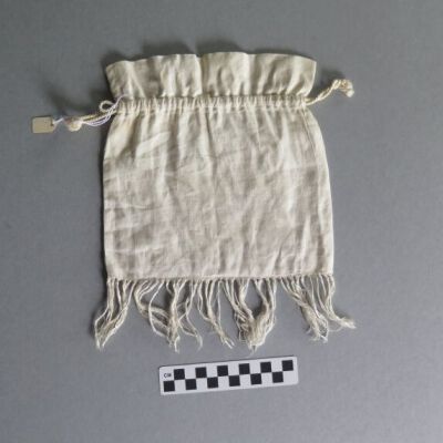 Back of pouch: Origsize: 9" (w) x 10" (l); Origformat: Artifact