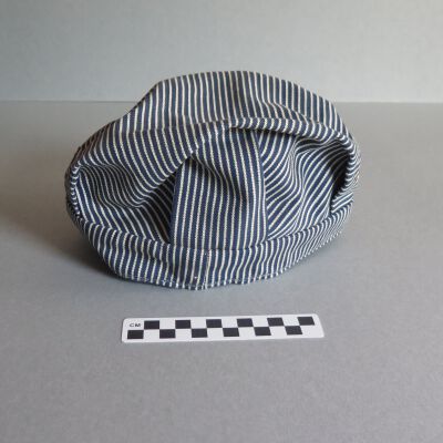 Back of hat.: Origsize: 6" (h) x 10" (w) x 1; Origformat: Artifact