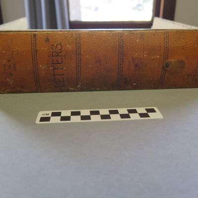 Spine of letter holder.: Origsize: 3" (h) x 11.5" (w) x; Origformat: Artifact