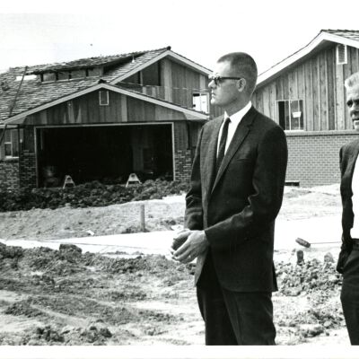 Photo of Chris Deitz, Mayor Don DesCombes, Jack W. Mefford in front of new houses
