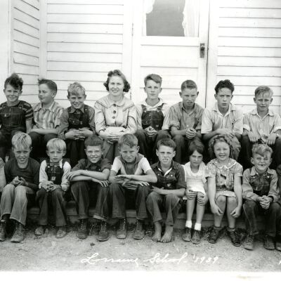 Students sitting on steps in front of Lorraine School. Year 1939