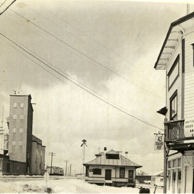 Broomfield train depot by grain elevator and Jone's Hall, circa 1970: Origsize: 8" x 10"; Origformat: Print-Photographic; Resolution: 500dpi