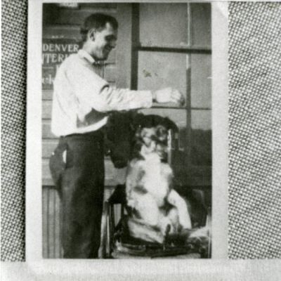 Richard Vaughn with his dog, Brownie, at the Broomfield depot, 1920: Origsize: 3.5" x 5"; Origformat: Print-Photographic; Resolution: 1000dpi