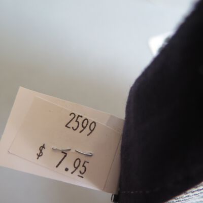 Back of tag in hat.: Origsize: 5" (h) x 9.5" (w) x; Origformat: Artifact