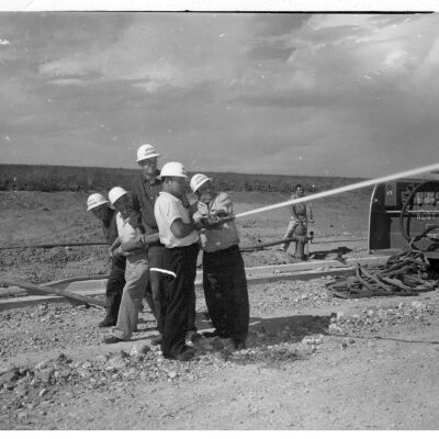 Six Men Testing Newly Installed Fire Hydrant