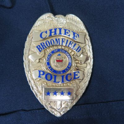 Close up of badge on shirt.: Origsize: 18" (w) x 33" (l); Origformat: Artifact
